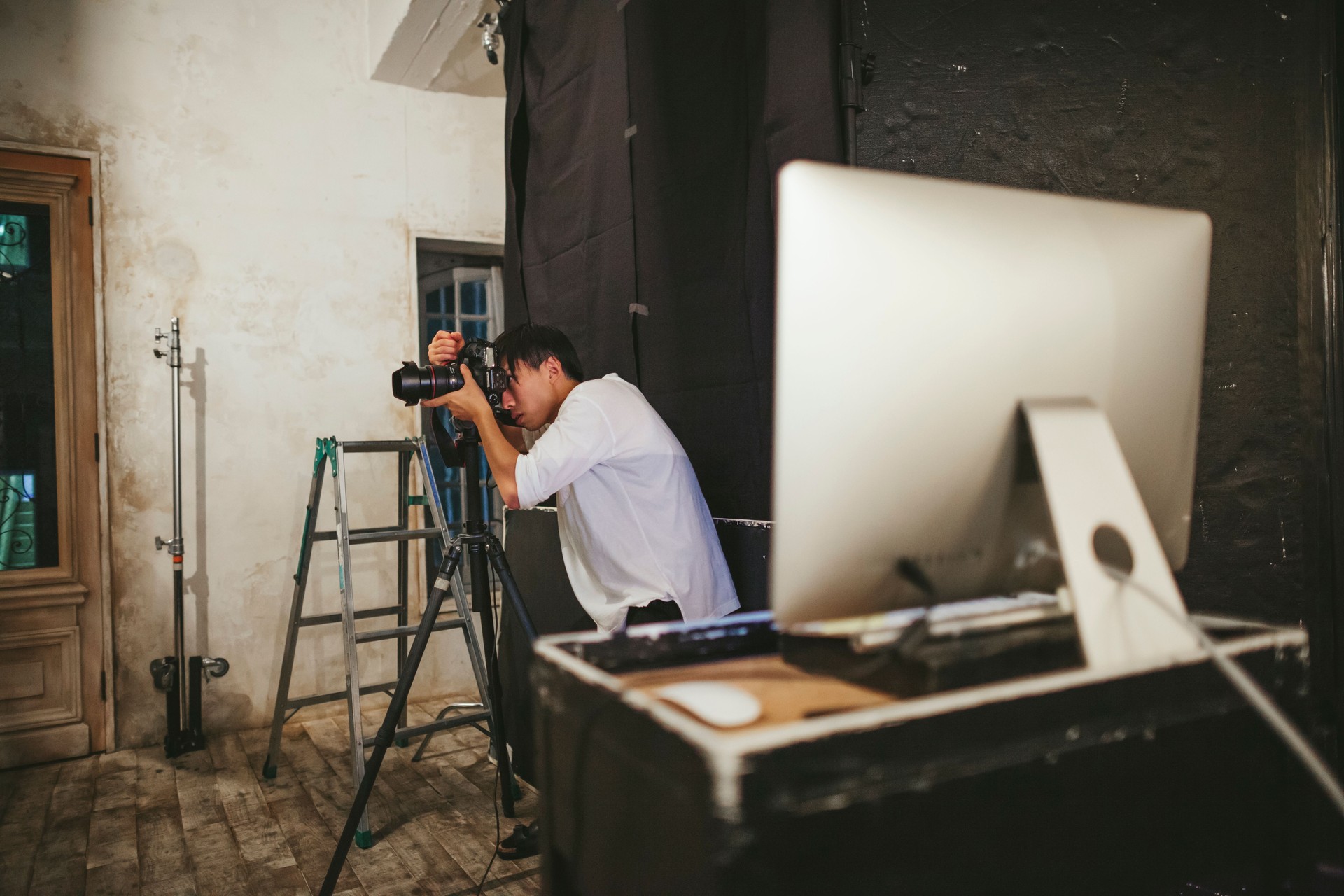 Professional photograher taking photos in his studio